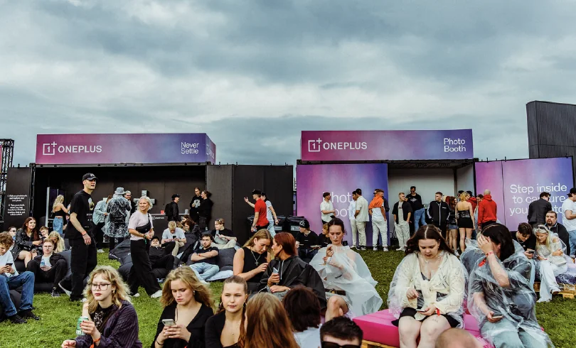 Festival-goers relaxing at the OnePlus lounge and photo booth at Blockfest