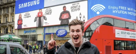 A creator filming in front of Made For You screens at Piccadilly Circus