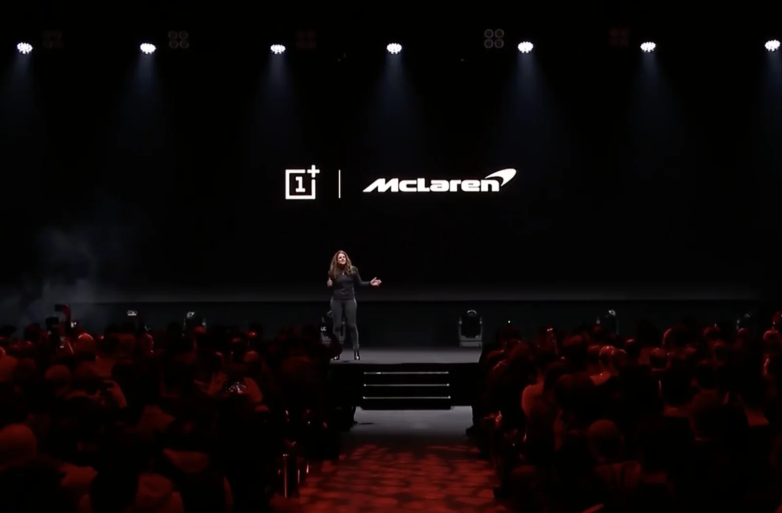 Kate on stage presenting the OnePlus and McLaren partnership