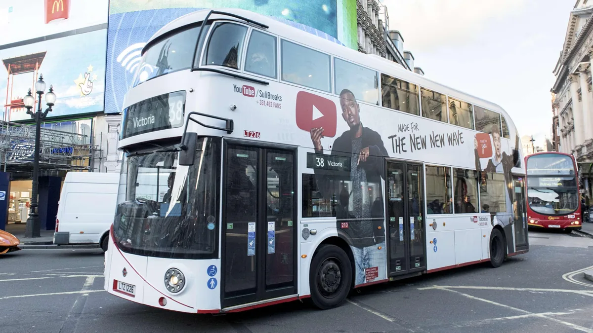 London bus wrapped in the YouTube Made For You campaign at Piccadilly Circus