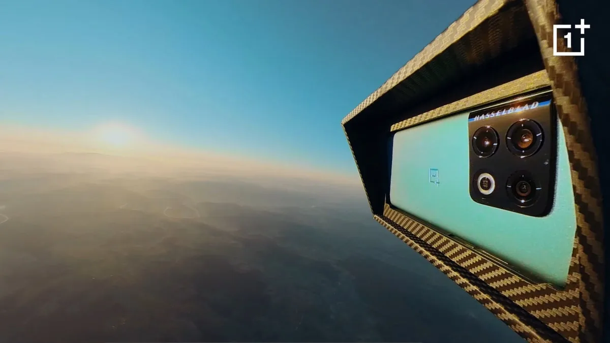 OnePlus phone with Hasselblad camera in a carbon-fibre housing, high above the Earth at sunrise