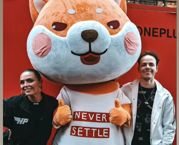 Creators with the Never Settle mascot at a OnePlus event